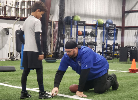 Kansas City Athlete Training Running Back Football Academy Group Classes and Private Running Back 1 on 1 Lessons for youth, middle school and high school football players looking to improve and excel at the Running Back position with fundamentals being taught at the WeTrainKC Indoor Facility in Kansas City Missouri